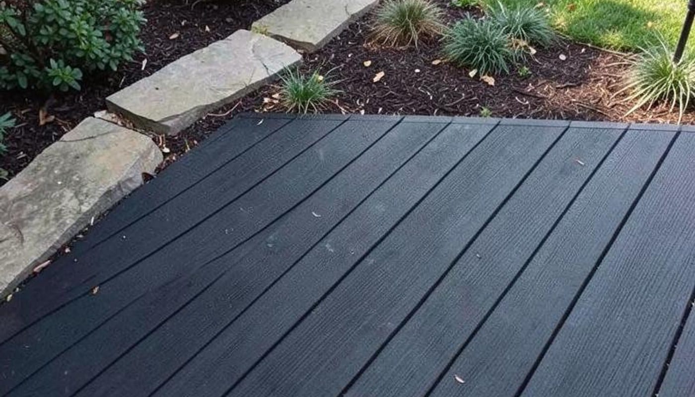 Dark diagonal surface texture adds subtle contrast to a landscaping scene