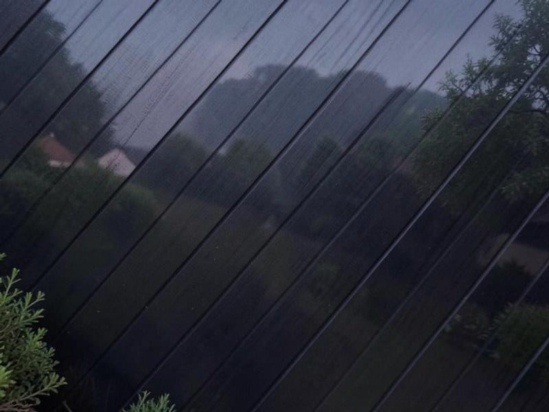 Dark diagonally patterned material creates a subtle landscape backdrop